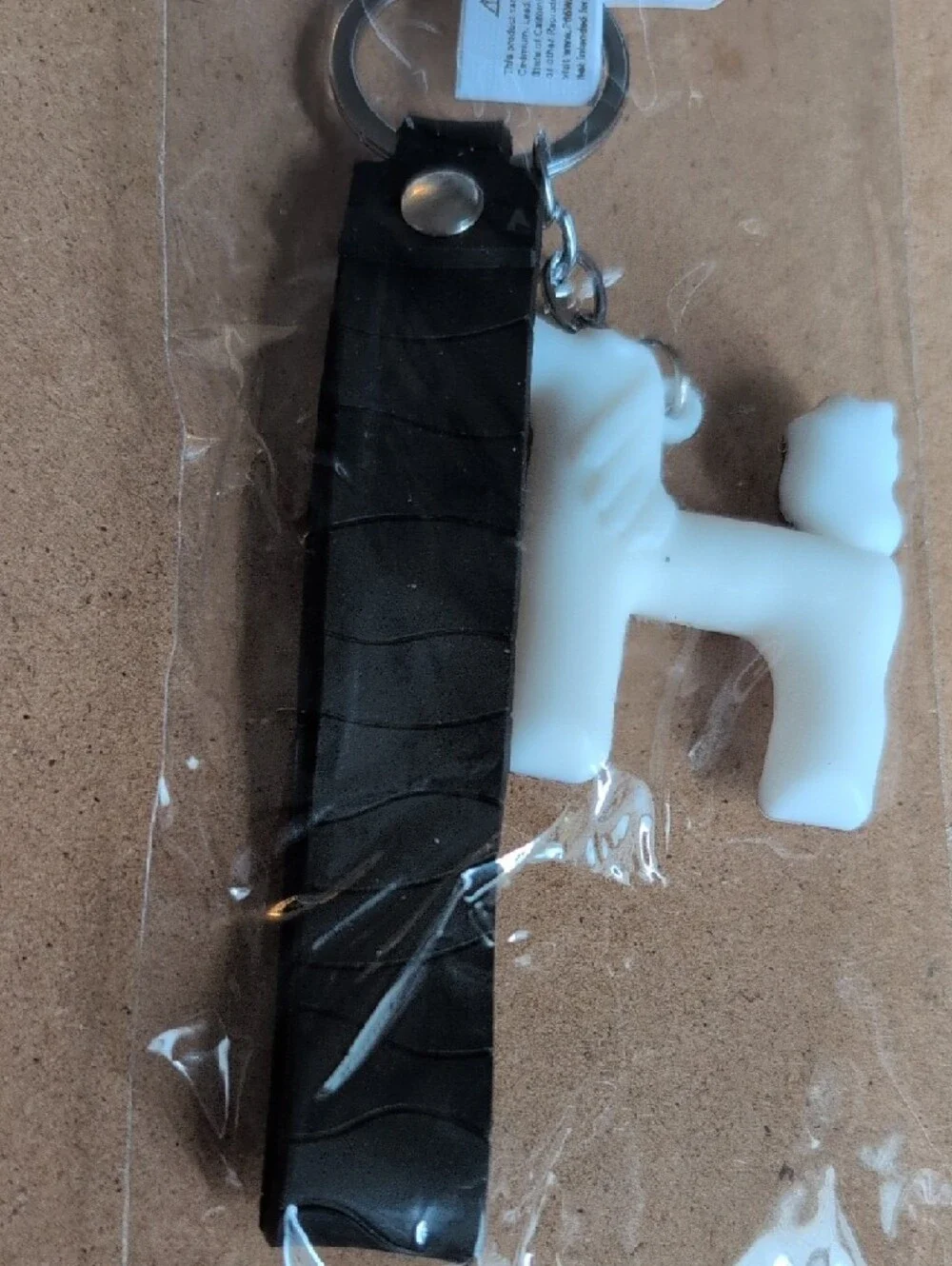 White Pony Keychain with Brown Mane and Black 'Good Luck' Strap